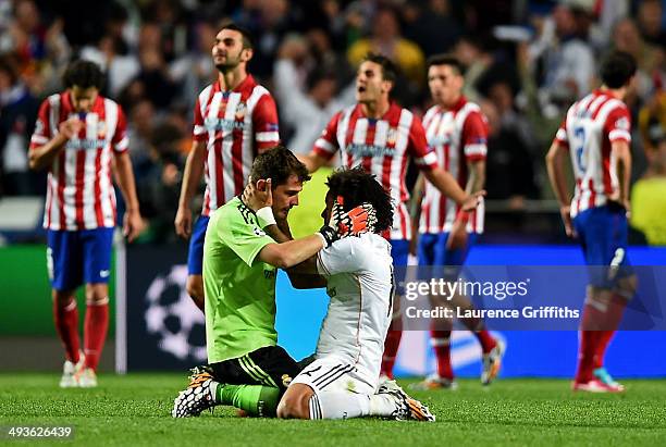 Iker Casillas celebrates with Marcelo of Real Madrid after Sergio Ramos of Real Madrid a late equaliser in stoppage time during the UEFA Champions...
