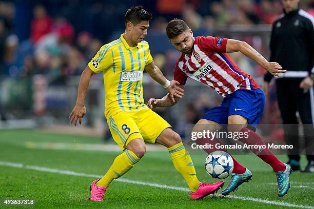 Guilherme Madalena Siqueira of Atletico de Madrid competes for the ball with Georgi Zhukov of FC Astana during the UEFA Champions League Group C...