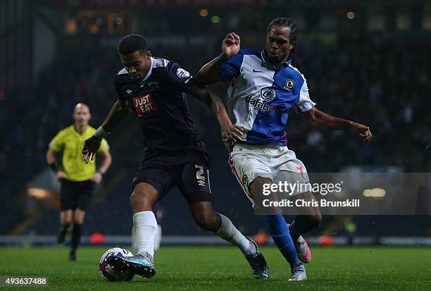 Nathan Delfouneso of Blackburn Rovers in action with Cyrus Christie of Derby County during the Sky Bet Championship match between Blackburn Rovers...