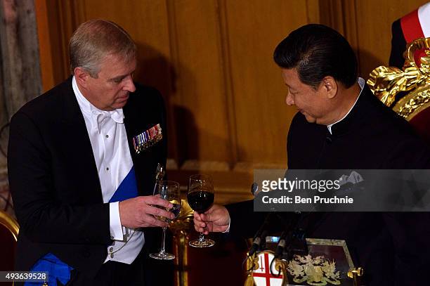 Prince Andrew, Duke of York and President of the People's Republic of China Xi Jinping toast after the president's speech at the end of the Lord...