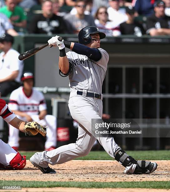 Jacoby Ellsbury of the New York Yankees hits a solo home run in the 10th inning against the Chicago White Sox at U.S. Cellular Field on May 24, 2014...