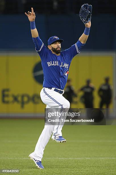 Jose Bautista of the Toronto Blue Jays celebrates defeating the Kansas City Royals 7-1 in game five of the American League Championship Series at...