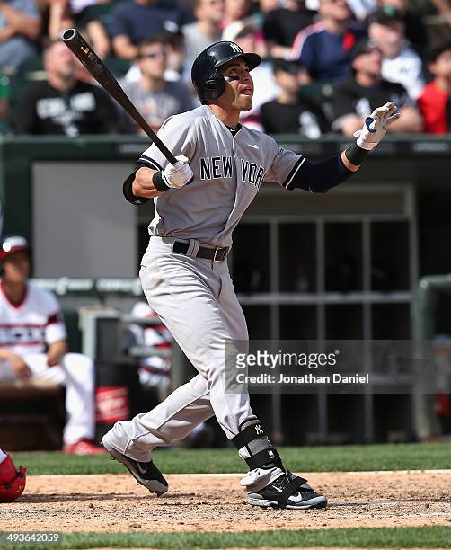 Jacoby Ellsbury of the New York Yankees hits a solo home run in the 10th inning against the Chicago White Sox at U.S. Cellular Field on May 24, 2014...