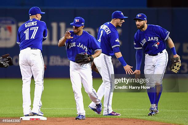 Ryan Goins of the Toronto Blue Jays, Ben Revere of the Toronto Blue Jays, Troy Tulowitzki of the Toronto Blue Jays, and Kevin Pillar of the Toronto...