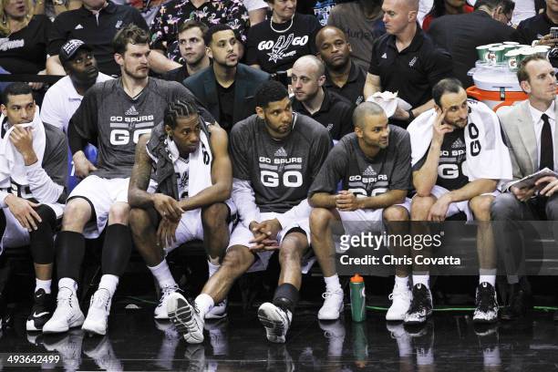 Danny Green, Tiago Splitter, Kawhi Leonard, Tim Duncan, Tony Parker and Manu Ginobili of the San Antonio Spurs watch from the bench as their team...