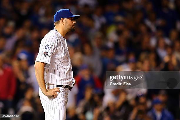 Jason Hammel of the Chicago Cubs reacts after giving up a three run home run to Lucas Duda of the New York Mets in the first inning during game four...