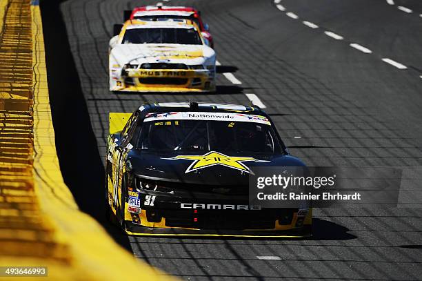 Dylan Kwasniewski, driver of the Rockstar Chevrolet, leads a pack of cars during the NASCAR Nationwide Series History 300 at Charlotte Motor Speedway...