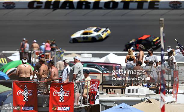 Fans watch from the tops of campers in the infield during the NASCAR Nationwide Series History 300 at Charlotte Motor Speedway on May 24, 2014 in...