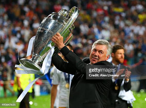 Head Coach, Carlo Ancelotti of Real Madrid celebrates with the Champions League trophy during the UEFA Champions League Final between Real Madrid and...
