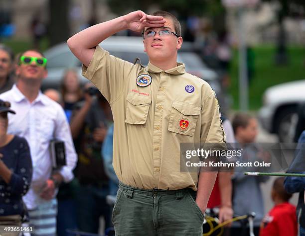 Noah Williams from Boy Scout Troupe 303 in Aurora salutes during the flag ceremony after the Memorial Day Parade and before the 15th Annual Memorial...