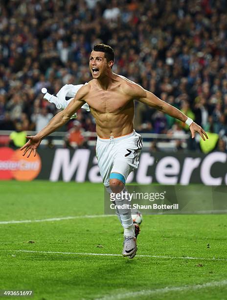 Cristiano Ronaldo of Real Madrid celebrates after scoring their fourth goal from the penalty spot during the UEFA Champions League Final between Real...