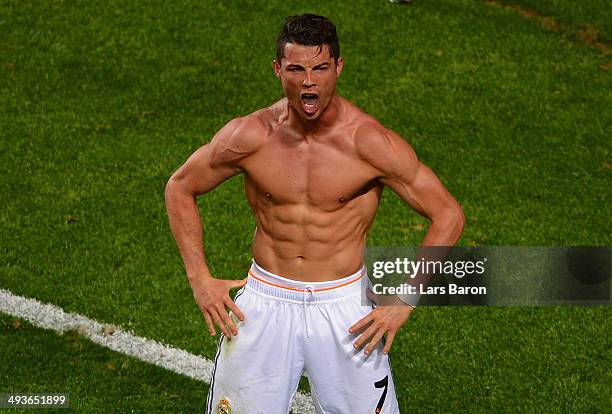 Cristiano Ronaldo of Real Madrid celebrates scoring their fourth goal from the penalty spot during the UEFA Champions League Final between Real...