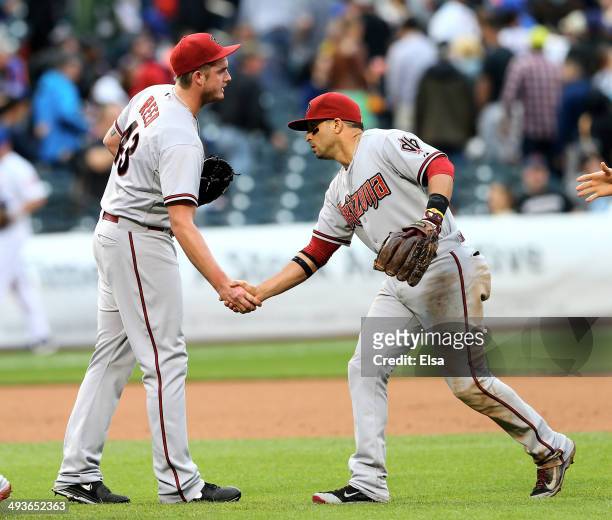 Addison Reed of the Arizona Diamondbacks is congratulated by teammate Martin Prado after the win over the New York Mets on May 24, 2014 at Citi Field...