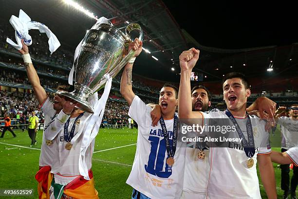 Angel Di Maria, Alvaro Arbeloa and Alvaro Morata of Real Madrid celebrate with the trophy after during the UEFA Champions League Final between Real...