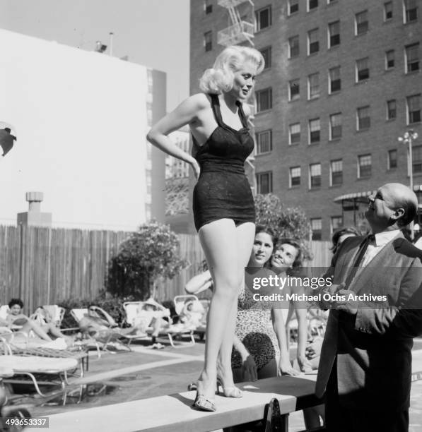 Actor Jackie Coogan talks to a model in Los Angeles,California.