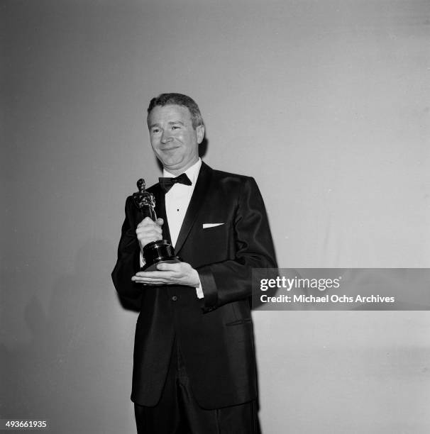 Actor Red Buttons poses with his Oscar for Best Supporting Actor in "Sayonara" in Los Angeles, California.