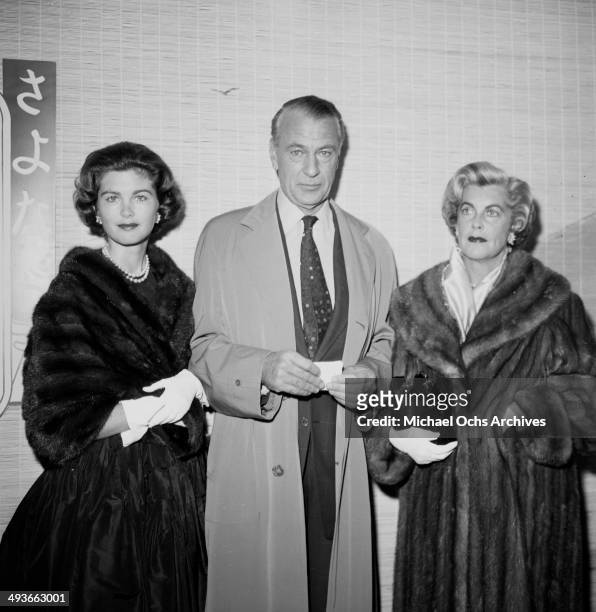 Actor Gary Cooper poses with wife Veronica Balfe and their daughter Maria Cooper as they attend a WAIF ball in Los Angeles,California.