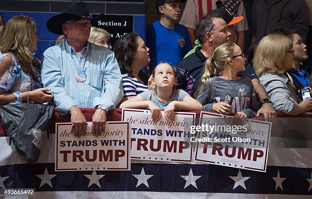 Guests wait for Republican presidential candidate Donald Trump to speak at a campaign rally at Burlington Memorial Auditorium on October 21, 2015 in...