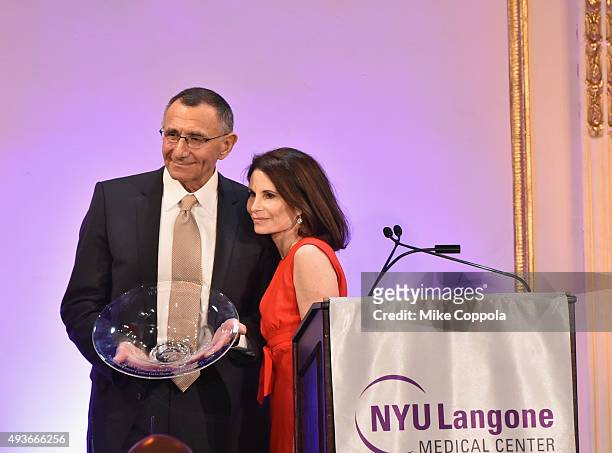 Dr. Hersch Leon Pachter accepts his NYU Langone Medical Center's Perlmutter Cancer Center Honoree Award from Lori Fink at NYU Langone Medical...