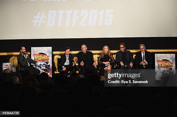 Michael J. Fox, Christopher Lloyd, Lea Thompson, Huey Lewis, and Bob Gale speak onstage with moderator Aaron Sagers during the Back to the Future...