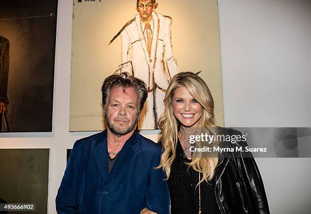 Musician/artist John Mellencamp and model/actress Christie Brinkley attend Mr. Mellencamp's art exhibition opening "The Isolation Of Mister" at the...