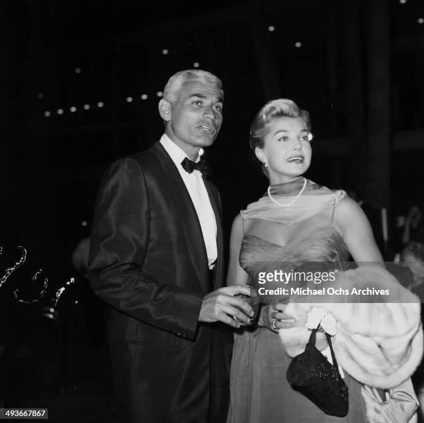 Actor Jeff Chandler with wife attend a party in Los Angeles, California.