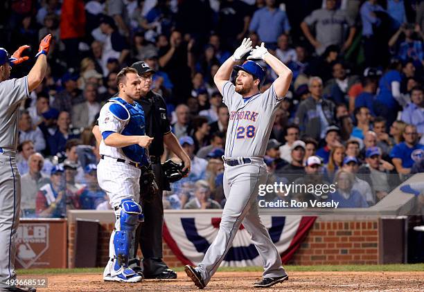 Daniel Murphy of the New York Mets hits a two-run home run in the top of the eighth inning of Game 4 of the NLCS against the Chicago Cubs at Wrigley...