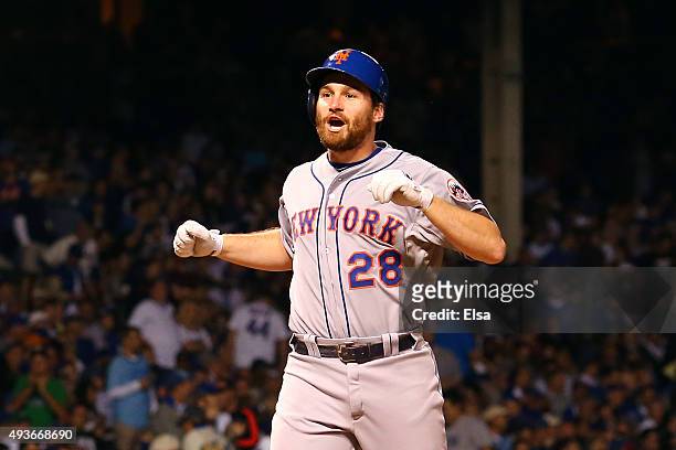 Daniel Murphy of the New York Mets celebrates after hitting a two run home run in the eighth inning against Pedro Strop of the Chicago Cubs during...