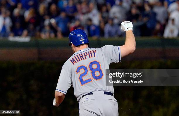 Daniel Murphy of the New York Mets celebrates after hitting a two-run home run in the top of the eighth inning of Game 4 of the NLCS against the...