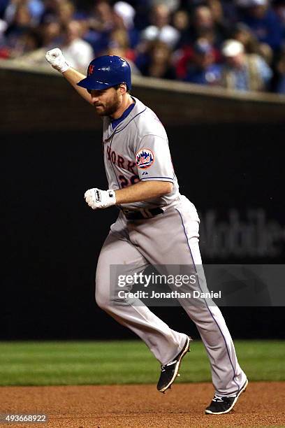 Daniel Murphy of the New York Mets rounds the bases after hitting a two run home run in the eighth inning against Fernando Rodney of the Chicago Cubs...