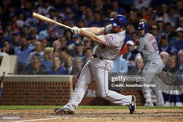Daniel Murphy of the New York Mets hits a two run home run in the eighth inning against Fernando Rodney of the Chicago Cubs during game four of the...