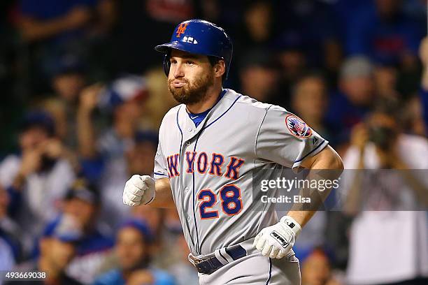 Daniel Murphy of the New York Mets celebrates after hitting a two run home run in the eighth inning against Fernando Rodney of the Chicago Cubs...