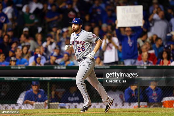 Daniel Murphy of the New York Mets celebrates after hitting a two run home run in the eighth inning against Fernando Rodney of the Chicago Cubs...