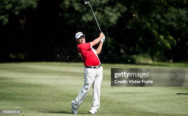 Jason Barnes of England plays his second shot on the 15th hole during the first round of the UBS Hong Kong Open at the Hong Kong Golf Club on October...