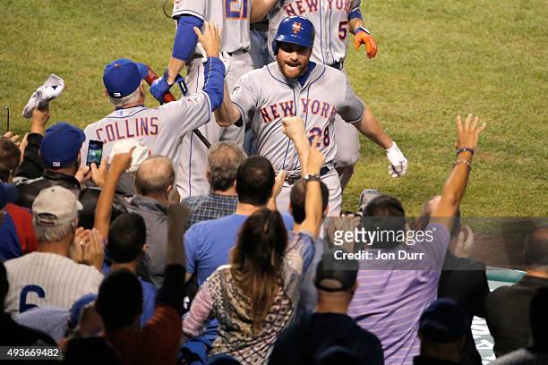 Daniel Murphy of the New York Mets celebrates with manager Terry Collins after hitting a two run home run in the eighth inning against Pedro Strop of...