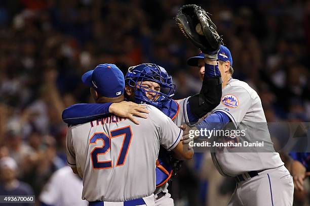 Jeurys Familia, Kelly Johnson and Travis d'Arnaud of the New York Mets celebrate after defeating the Chicago Cubs in game four of the 2015 MLB...