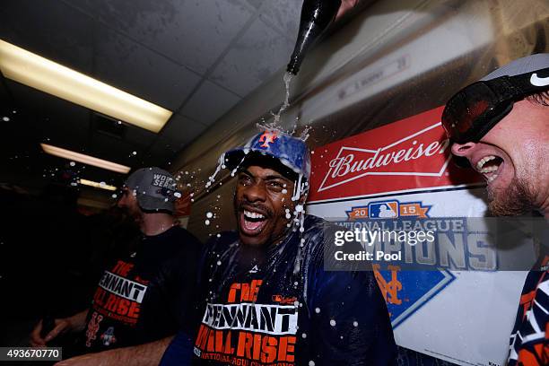 Curtis Granderson of the New York Mets celebrates in the locker room with his teammates after defeating the Chicago Cubs in game four of the 2015 MLB...