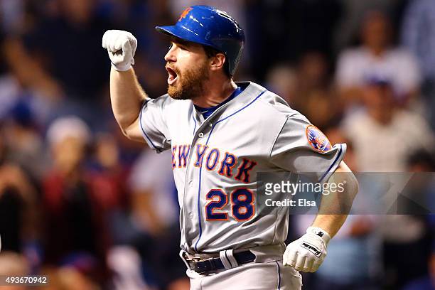 Daniel Murphy of the New York Mets celebrates after hitting a two run home run in the eighth inning against Fernando Rodney of the Chicago Cubs...