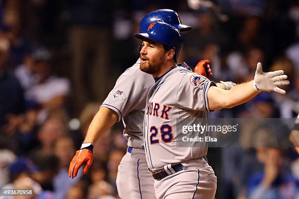 Daniel Murphy of the New York Mets celebrates after hitting a two run home run in the eighth inning against Fernando Rodney of the Chicago Cubs...