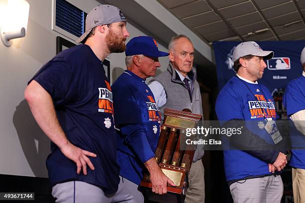 Manager Terry Collins of the New York Mets holds the NLCS trophy after defeating the Chicago Cubs in game four of the 2015 MLB National League...