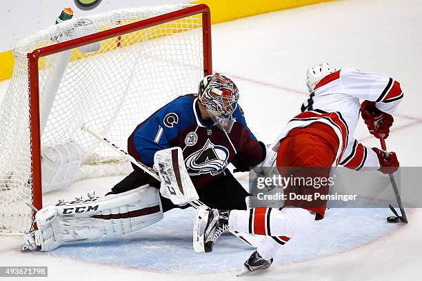 Victor Rask of the Carolina Hurricanes puts the puck past goalie Semyon Varlamov of the Colorado Avalanche for the game winning goal in overtime at...