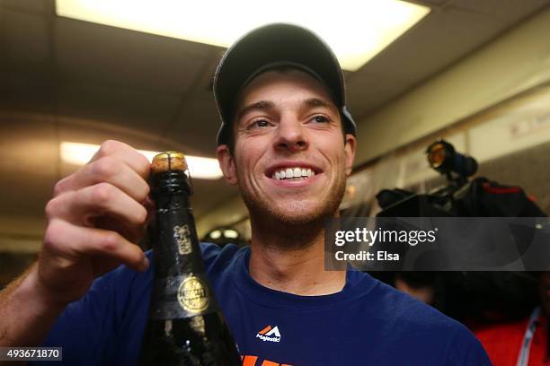 David Wright of the New York Mets celebrates in the locker room with his teammates after defeating the Chicago Cubs in game four of the 2015 MLB...