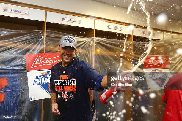 Matt Reynolds of the New York Mets celebrates in the locker room with his teammates after defeating the Chicago Cubs in game four of the 2015 MLB...