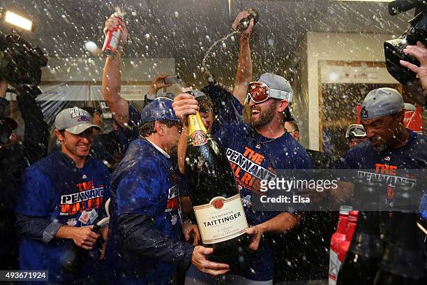Jonathon Niese of the New York Mets celebrates in the locker room with his teammates after defeating the Chicago Cubs in game four of the 2015 MLB...