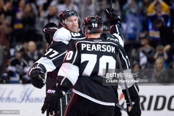 Jeff Carter, Tanner Pearson and Tyler Toffoli of the Los Angeles Kings celebrate after Carter scores a second period goal against the Chicago...