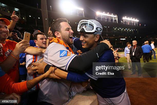 Juan Lagares of the New York Mets celebrates with fans after defeating the Chicago Cubs in game four of the 2015 MLB National League Championship...