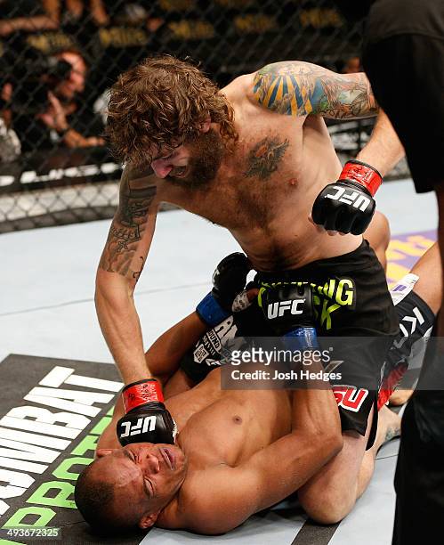 Michael Chiesa punches Francisco Trinaldo in their lightweight bout during the UFC 173 event at the MGM Grand Garden Arena on May 24, 2014 in Las...