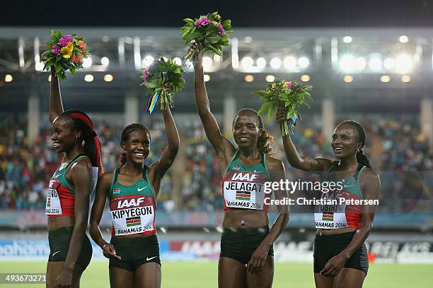 Mercy Cherono, Faith Chepngetich Kipyegon, Irene Jelagat and Hellen Onsando Obiri of Kenya celebrate on the podium after setting a new world record...
