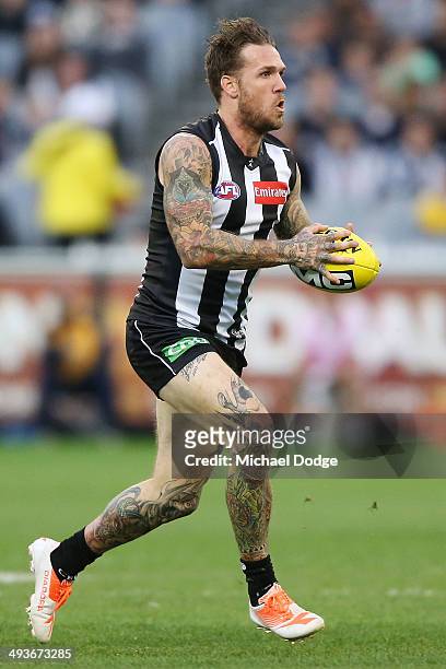 Dane Swan of the Magpies runs with the ball during the round 10 AFL match between the Collingwood Magpies and West Coast Eagles at Melbourne Cricket...