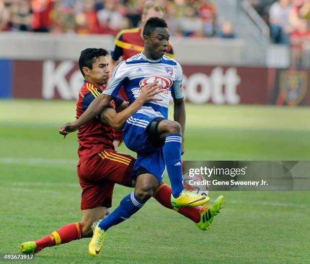 Tony Beltran of Real Salt Lake grabs Fabian Castillo of FC Dallas as the try for the ball during first half play at Rio Tinto Stadium May 24, 2014 in...